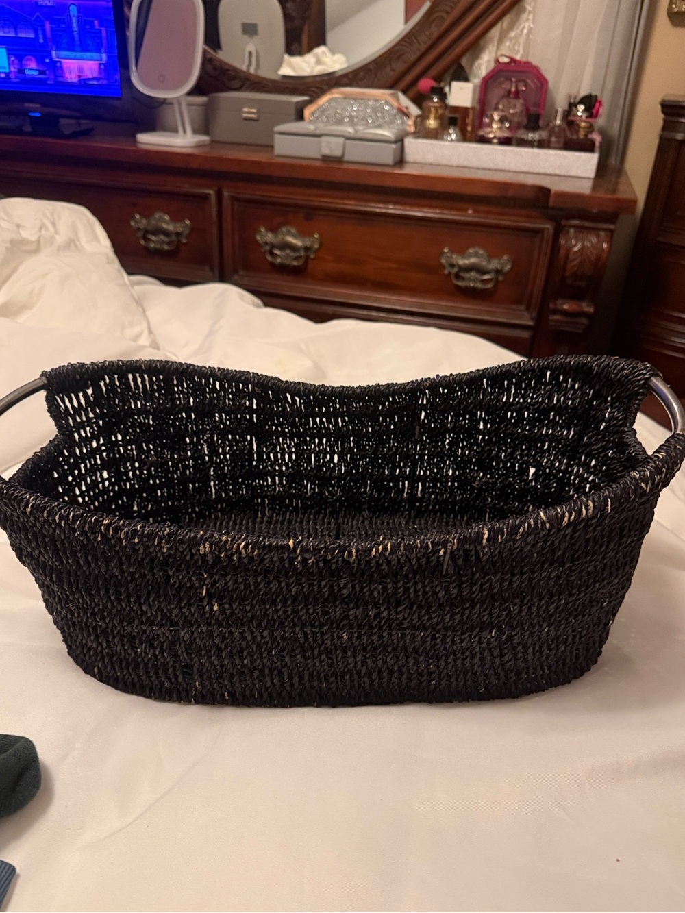 Black accent basket oval shaped with metal handles